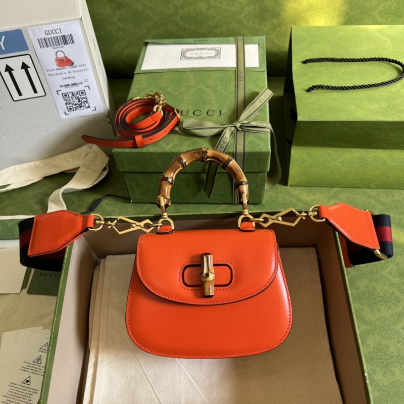 G*u*i top handle bags